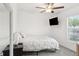 Comfortable bedroom with a ceiling fan and a window at 36642 Garden Wall Way, Zephyrhills, FL 33541