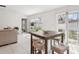 Dining area with table, seating, and sliding glass doors to the outside at 36642 Garden Wall Way, Zephyrhills, FL 33541