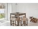 Cozy dining area with tile floors and natural light from sliding glass doors at 36642 Garden Wall Way, Zephyrhills, FL 33541