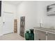 Welcoming foyer with decorative accents, tiled floor, and a view of the front door at 36642 Garden Wall Way, Zephyrhills, FL 33541