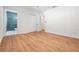 View of the primary bedroom boasting hardwood floors and access to a modern bathroom with a tiled shower at 3908 W Laurel St, Tampa, FL 33607