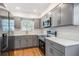 Well-lit kitchen features modern appliances, gray cabinets, and light countertops at 3908 W Laurel St, Tampa, FL 33607