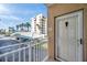 View from the balcony of the building, parking, and surrounding landscaping at 399 150Th Ave # 101, Madeira Beach, FL 33708