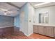 Bathroom featuring a vanity, cabinetry, and a doorway to the Primary bedroom at 411 Dolphin S Dr, Oldsmar, FL 34677