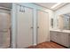 A clean bathroom featuring a shower and single sink vanity at 411 Dolphin S Dr, Oldsmar, FL 34677