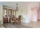 Dining room featuring a chandelier and built-in cabinets at 411 Dolphin S Dr, Oldsmar, FL 34677