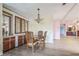 Dining room featuring a chandelier and built-in cabinets at 411 Dolphin S Dr, Oldsmar, FL 34677