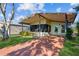 Charming single-story home featuring a covered porch, landscaped yard, and cozy curb appeal at 411 Dolphin S Dr, Oldsmar, FL 34677