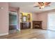 Cozy living room featuring a decorative fireplace, built-in bar, and sliding glass doors at 411 Dolphin S Dr, Oldsmar, FL 34677