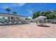 Spacious pool deck with tables, lounge chairs, and shaded areas, creating a resort-like atmosphere at 411 Dolphin S Dr, Oldsmar, FL 34677