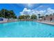 Sparkling blue pool with comfortable lounge chairs, providing the perfect spot for relaxation at 411 Dolphin S Dr, Oldsmar, FL 34677