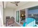 Comfortable outdoor seating with view to the interior living area and ceiling fan at 420 64Th Ave # 402, St Pete Beach, FL 33706