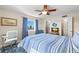 Well-lit bedroom with a comfortable sleeping area, desk, and closet at 420 64Th Ave # 402, St Pete Beach, FL 33706