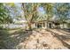 An incredible backyard featuring a large tree that provides shade and privacy at 421 Wayfarer Ct, Tarpon Springs, FL 34689