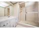 Traditional bathroom with a shower, a large mirror, and a single sink vanity at 421 Wayfarer Ct, Tarpon Springs, FL 34689