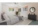 Bedroom with two windows, carpet, vintage wallpaper, and a stylish accent rug at 421 Wayfarer Ct, Tarpon Springs, FL 34689