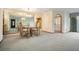 Dining area with glass table, light fixtures, and mirrored wall at 421 Wayfarer Ct, Tarpon Springs, FL 34689