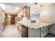 Galley kitchen featuring white countertops, appliances, and plenty of cabinet space at 421 Wayfarer Ct, Tarpon Springs, FL 34689