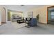 Bright living room featuring neutral tones, comfortable seating, and large windows at 421 Wayfarer Ct, Tarpon Springs, FL 34689