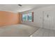 Bright living room featuring carpeted floors, a large window, and neutral wall colors at 4435 34Th N Ave, St Petersburg, FL 33713