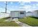 A large, outdoor shed in the backyard with a walkway and a window at 4435 34Th N Ave, St Petersburg, FL 33713