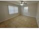 Bedroom with tile flooring, two windows providing ample natural light at 4790 81St N Ave, Pinellas Park, FL 33781