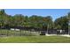 Dog park with fenced play area and mature trees at 4790 81St N Ave, Pinellas Park, FL 33781