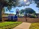 Colorful playground equipment set against a backdrop of a lake, perfect for Gathering fun and activities at 4790 81St N Ave, Pinellas Park, FL 33781