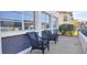 Exterior patio view with seating area, showing the building's facade and surrounding greenery at 4812 Jasper Dr Dr # 101, New Port Richey, FL 34652