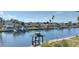 Expansive waterfront view with multiple docks and homes along the canal, captured on a sunny day at 4812 Jasper Dr Dr # 101, New Port Richey, FL 34652