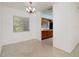 Open dining area with terrazzo floors leads to an adjacent kitchen at 4837 97Th N Way, St Petersburg, FL 33708