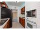 Functional kitchen featuring classic appliances and convenient layout, adjacent room visible at 4837 97Th N Way, St Petersburg, FL 33708