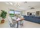 Open concept dining room area, which has sliding glass doors to the screened lanai at 4911 Sienna Isles Ave, Wimauma, FL 33598