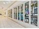 Hallway display cases showcase various art pieces and photography at 4911 Sienna Isles Ave, Wimauma, FL 33598