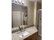 Bathroom with granite countertop, sink, mirror and tiled walk-in shower at 5125 Palm Springs Blvd # 11306, Tampa, FL 33647