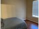 Bedroom with hardwood floors and a large window at 5125 Palm Springs Blvd # 11306, Tampa, FL 33647