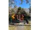 Colorful community playground featuring a variety of slides and climbing structures for Gathering fun at 5125 Palm Springs Blvd # 11306, Tampa, FL 33647