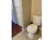 Toilet and laminate floor in bathroom at 5125 Palm Springs Blvd # 11306, Tampa, FL 33647