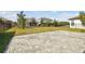 Spacious backyard featuring a stone-paved patio and a well-maintained lawn with fencing at 5134 Ballantrae Blvd, Land O Lakes, FL 34638