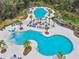 Aerial view of community pools with distinct areas for lap swimming and a leisure pool with a water slide at 5134 Ballantrae Blvd, Land O Lakes, FL 34638