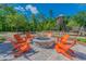 Cozy outdoor fire pit area with comfortable seating, perfect for gatherings and enjoying the natural surroundings at 5134 Ballantrae Blvd, Land O Lakes, FL 34638