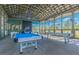 Bright and airy game room with ping pong and pool tables, offering a fun and engaging recreational space at 5134 Ballantrae Blvd, Land O Lakes, FL 34638