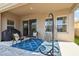 Inviting covered patio with outdoor seating, unique hanging chair, and sliding glass door to the interior at 5134 Ballantrae Blvd, Land O Lakes, FL 34638