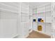 Spacious walk-in closet with custom shelving, drawers, and ample storage space at 531 Danube Ave, Tampa, FL 33606