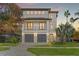 Modern two-story home offers ample parking, new construction design, and decorative lighting at 531 Danube Ave, Tampa, FL 33606