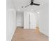 Hallway with light hardwood flooring and white doors at 531 Danube Ave, Tampa, FL 33606