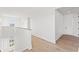 Hallway with hardwood floors and natural light, connecting different areas of the home at 531 Danube Ave, Tampa, FL 33606