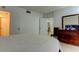 Comfortable bedroom featuring a bed, dresser, and neutral decor at 5396 Gulf Blvd # 110, St Pete Beach, FL 33706