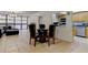 Open-plan dining room and kitchen area features tiled floors and plenty of natural light at 5396 Gulf Blvd # 110, St Pete Beach, FL 33706