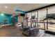 Bright gym with modern equipment, floor-to-ceiling windows, and beautiful outside view at 5396 Gulf Blvd # 110, St Pete Beach, FL 33706